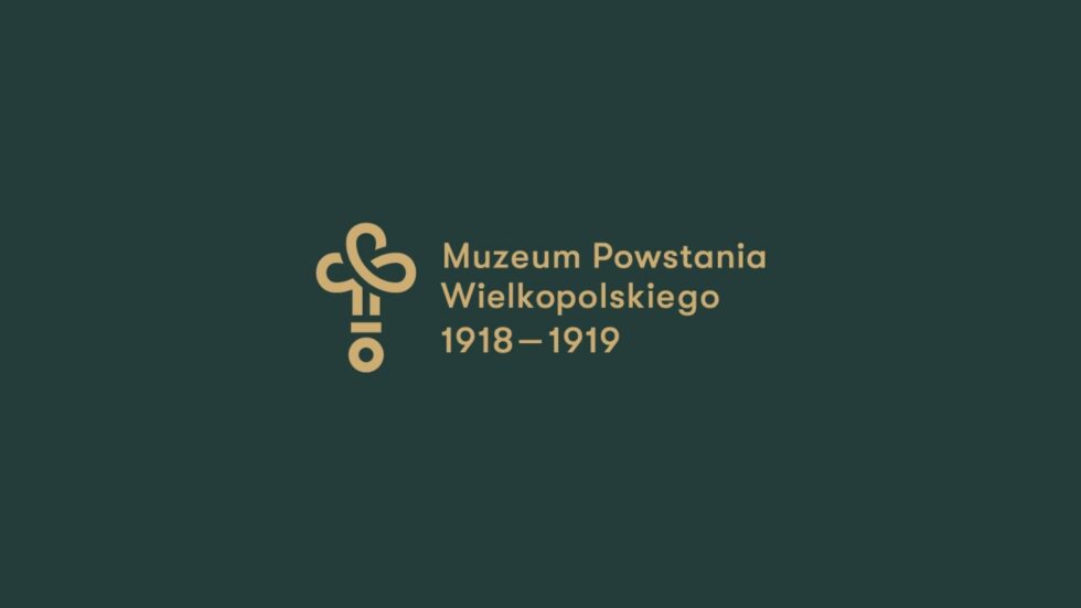 Symbol w kształcie trefla, obok niego napis